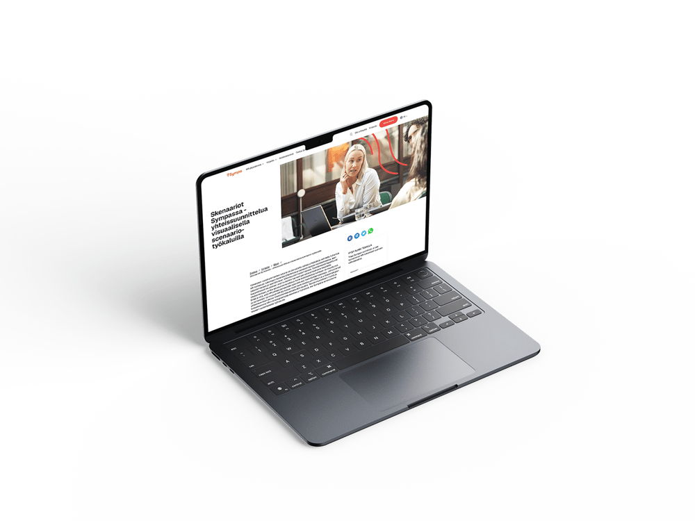 A laptop with a slim design and spacious keyboard shows a website with an article featuring a woman using a laptop.