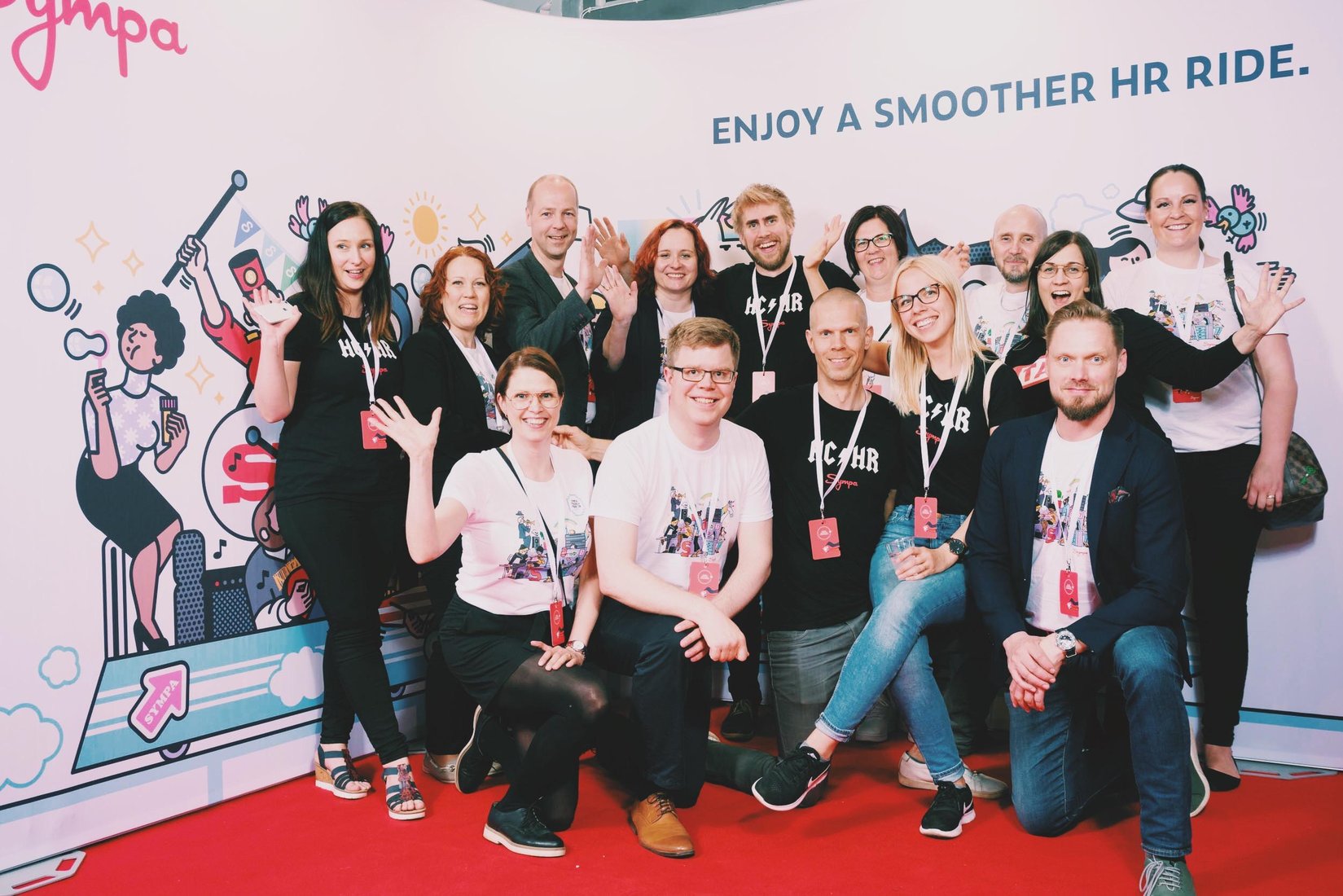 Sympaticos team posing in the Sympa booth