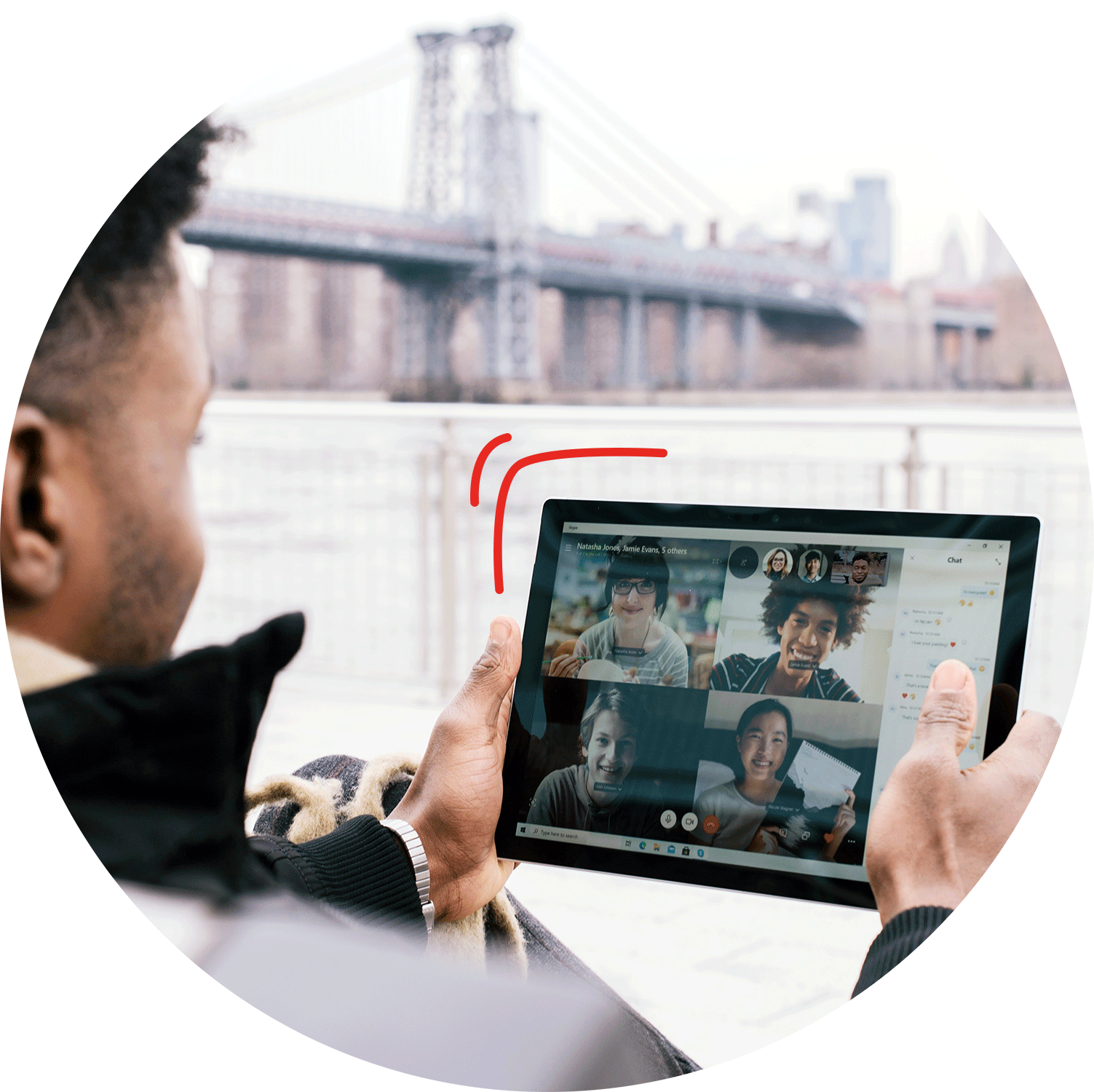 Person having an online meeting on their tablet while sitting outside